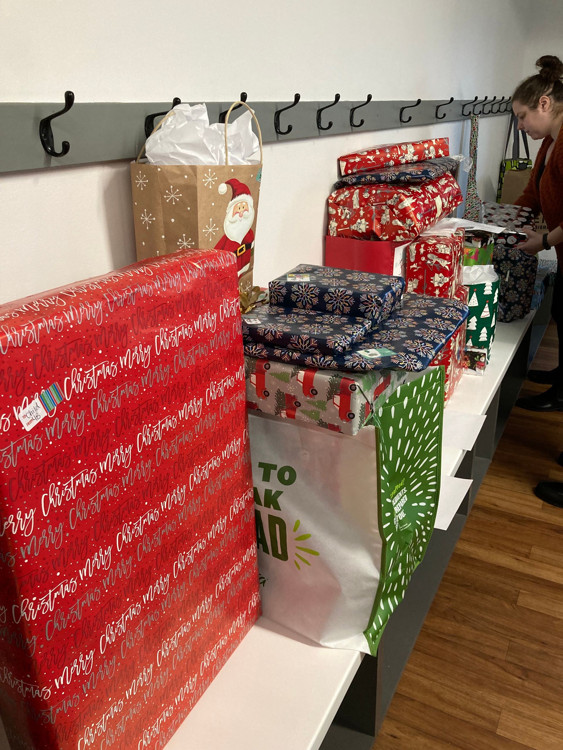 Gifts for Day Star Kids families, wrapped at a club meeting