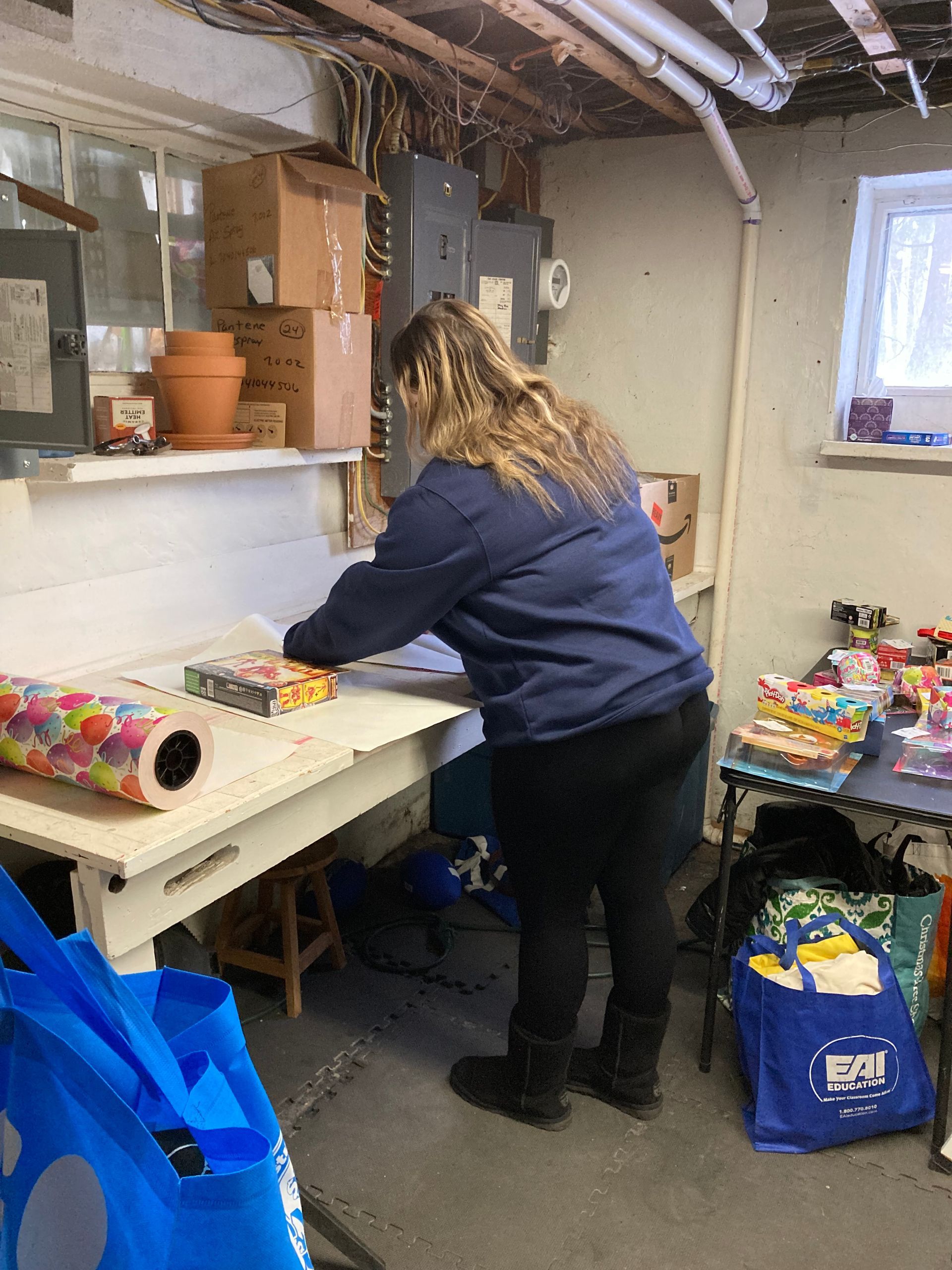 Kiwanians help pack bags for school students in high-poverty school districts around Rochester