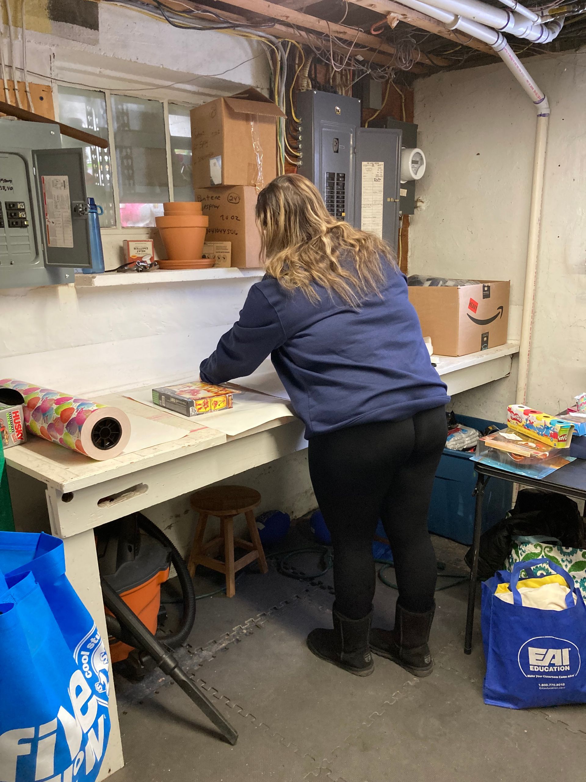 Kiwanians help pack bags for school students in high-poverty school districts around Rochester