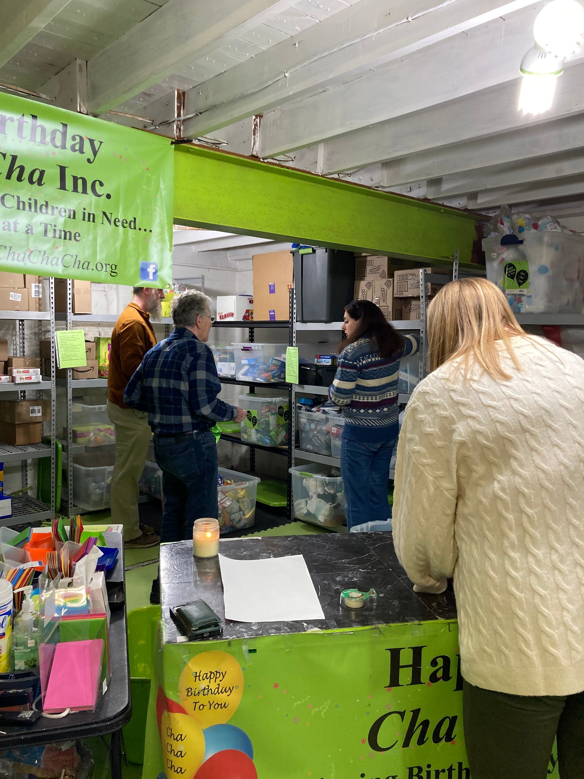 Kiwanians help pack bags for school students in high-poverty school districts around Rochester