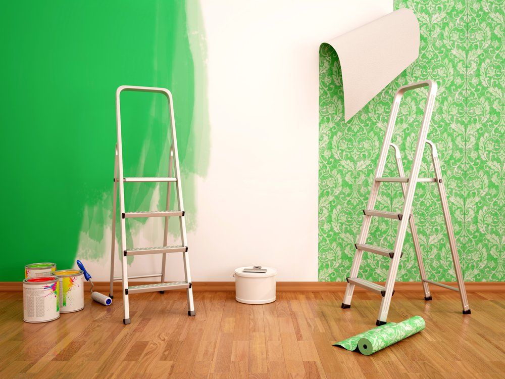 wall paper being attached to a wall