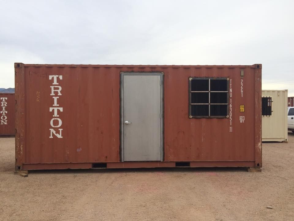 A triton shipping container with a door and window