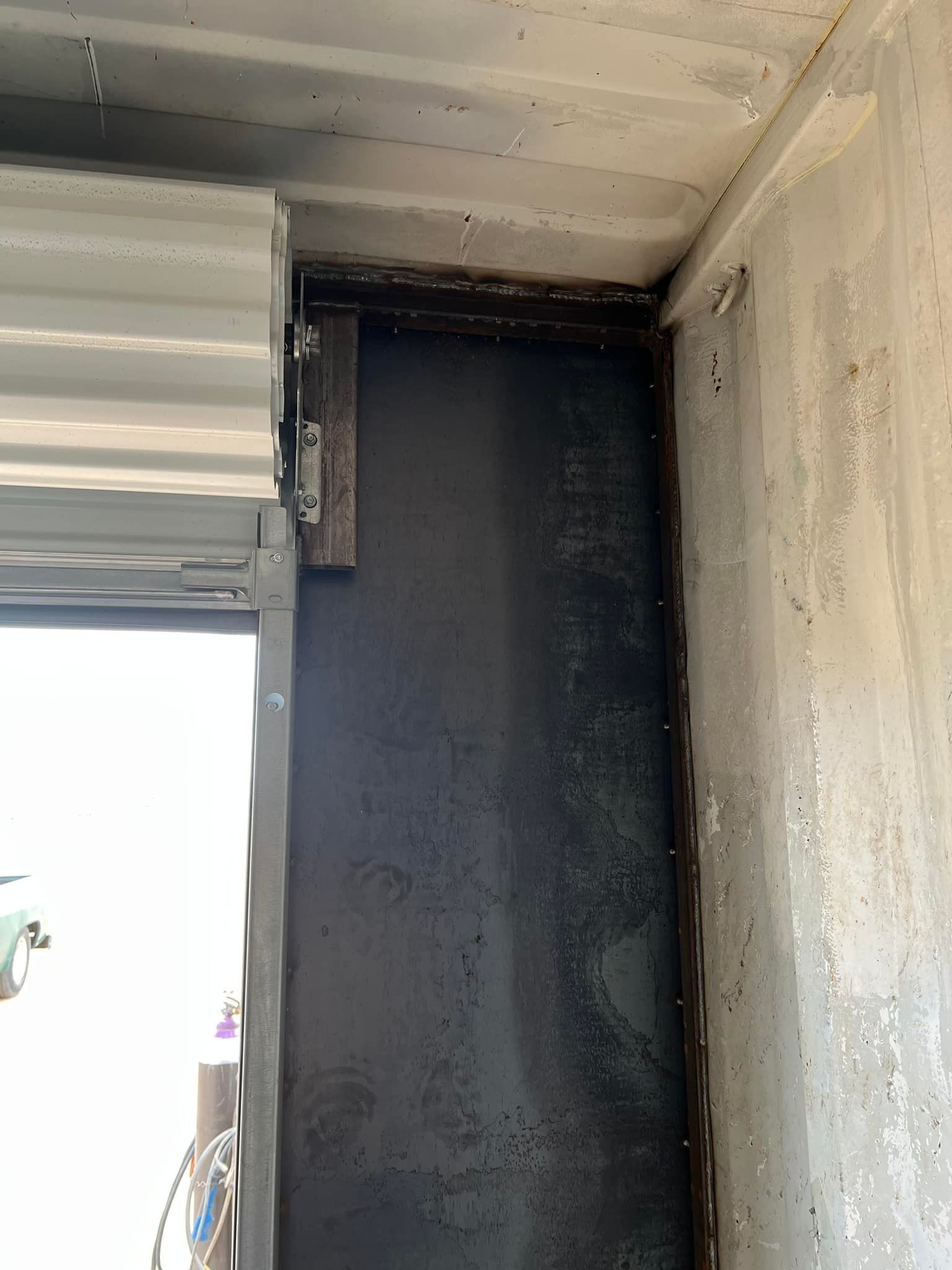 A close up of a door with a roller shutter on it