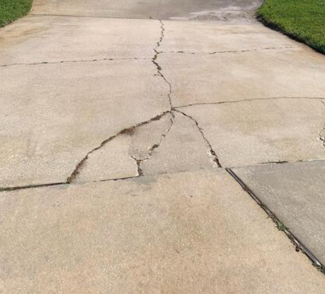 cracked driveway in conroe texas near houston