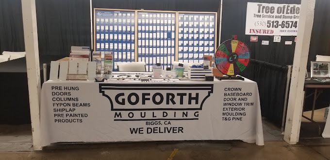 A table with a sign that says goforth molding we deliver