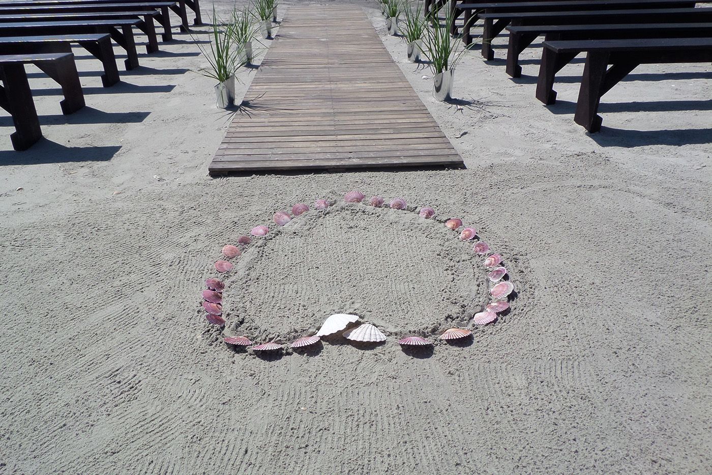 A wooden aisle with a circle of petals on the ground
