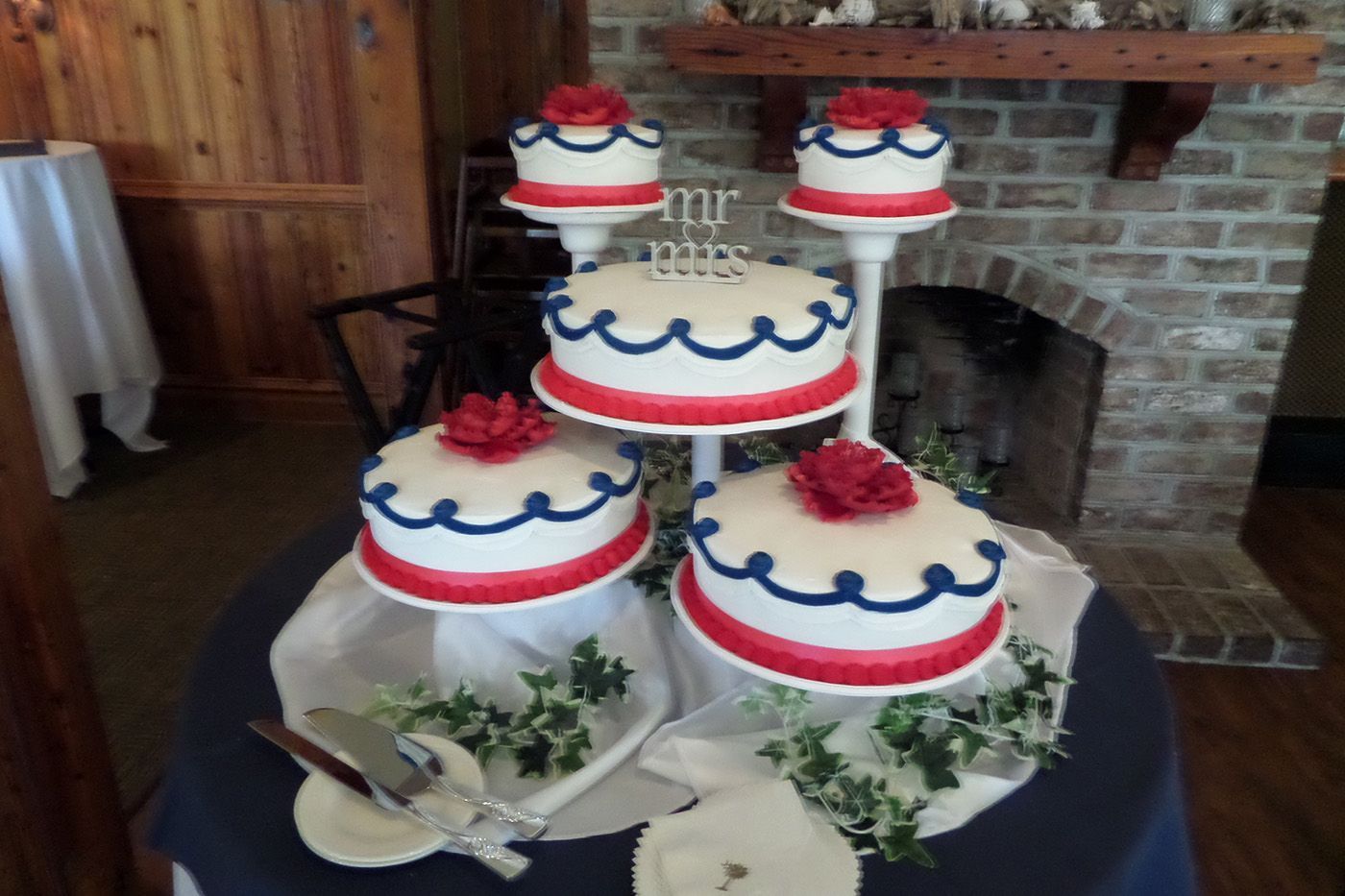 A red white and blue wedding cake on a table