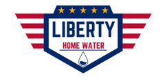 Logo of Liberty Home Water. A shield-shaped emblem in blue and white with a water drop icon. Red and white wings extend outwards.