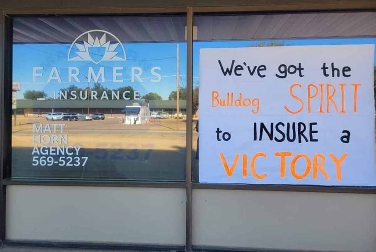 Window display for Farmers Insurance with a sign reading 