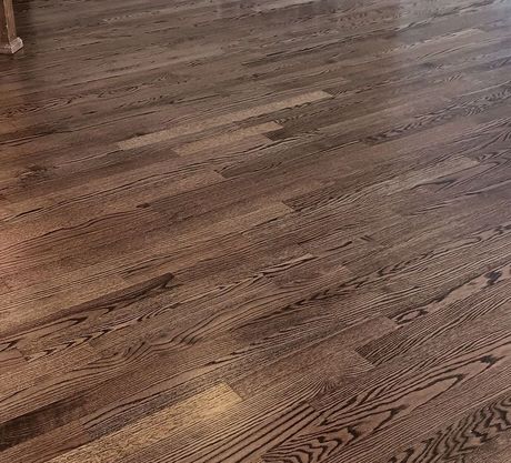 Woman Meditating on Wooden Floor — Floor Installation in Northlenn, CO