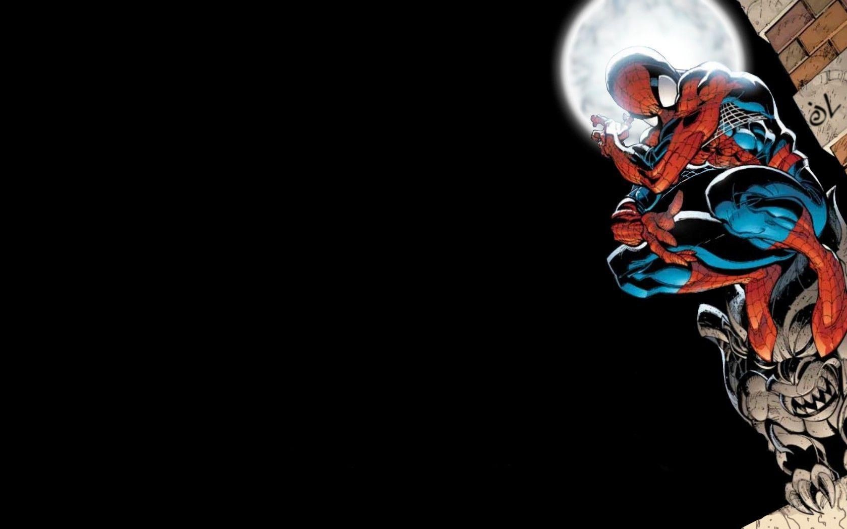 Spider-Man perched on a building at night, with a full moon behind him.