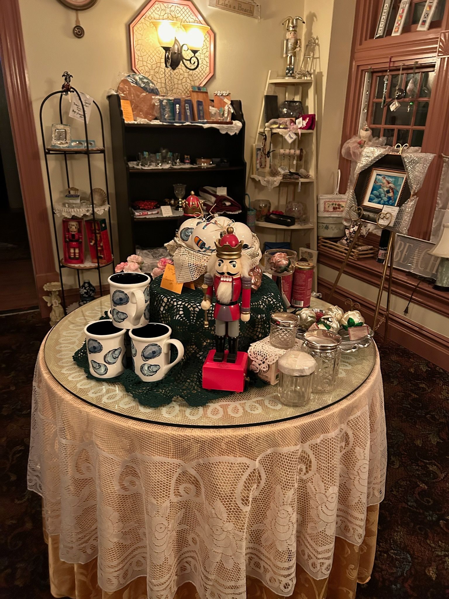 A plate of cookies and a cup of tea on a table.