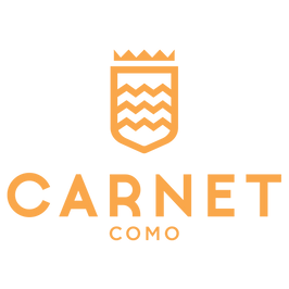 A logo for carnet como with a shield and a crown