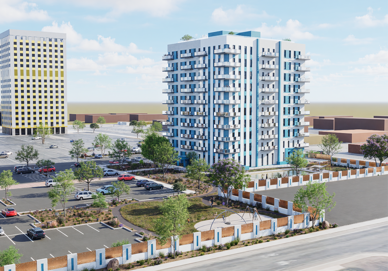 Buildings and a parking lot with trees and cars on a sunny day.