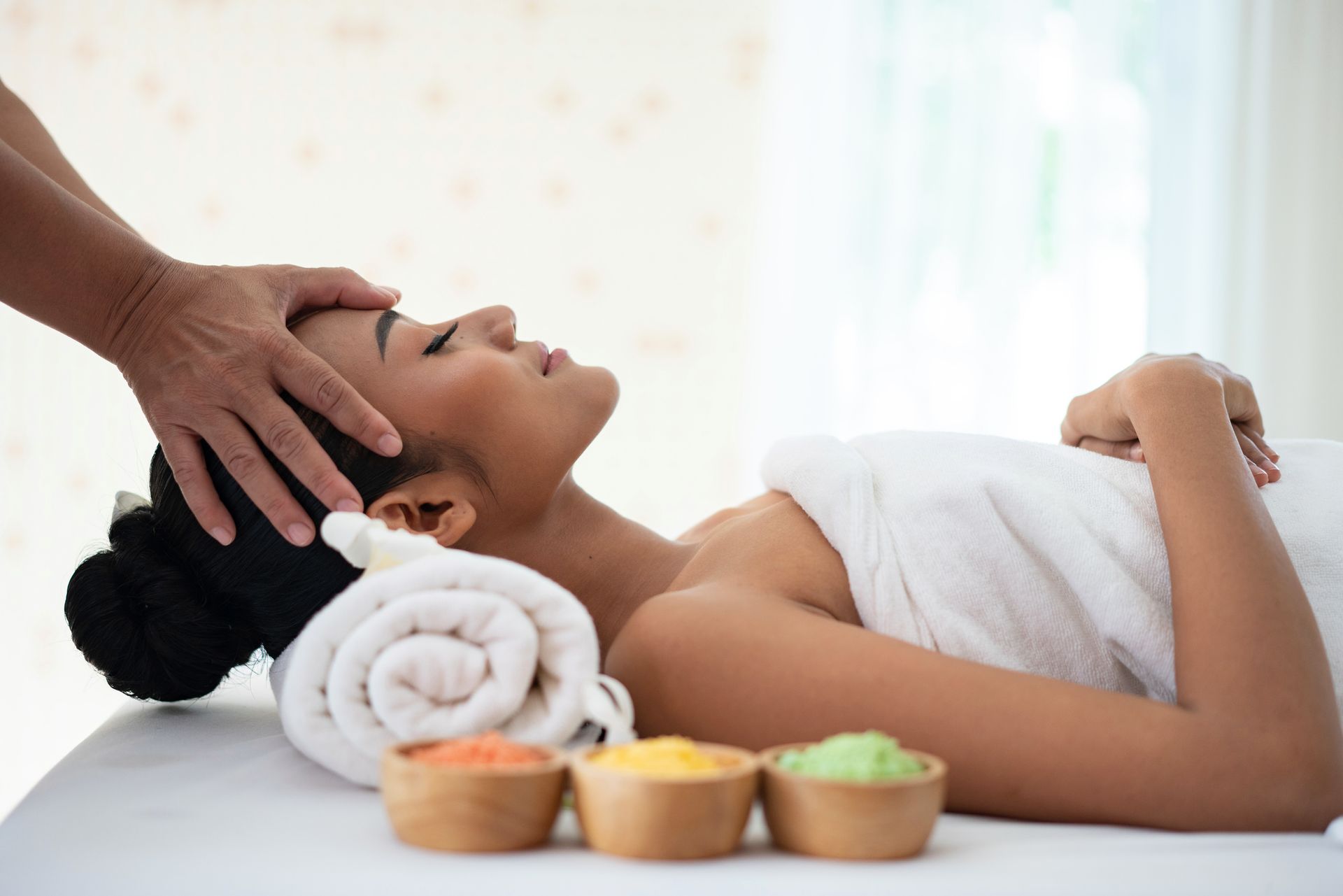 A Woman Is Getting a Head Massage at A Spa - Honolulu, HI - Hawaii Choi Spa
