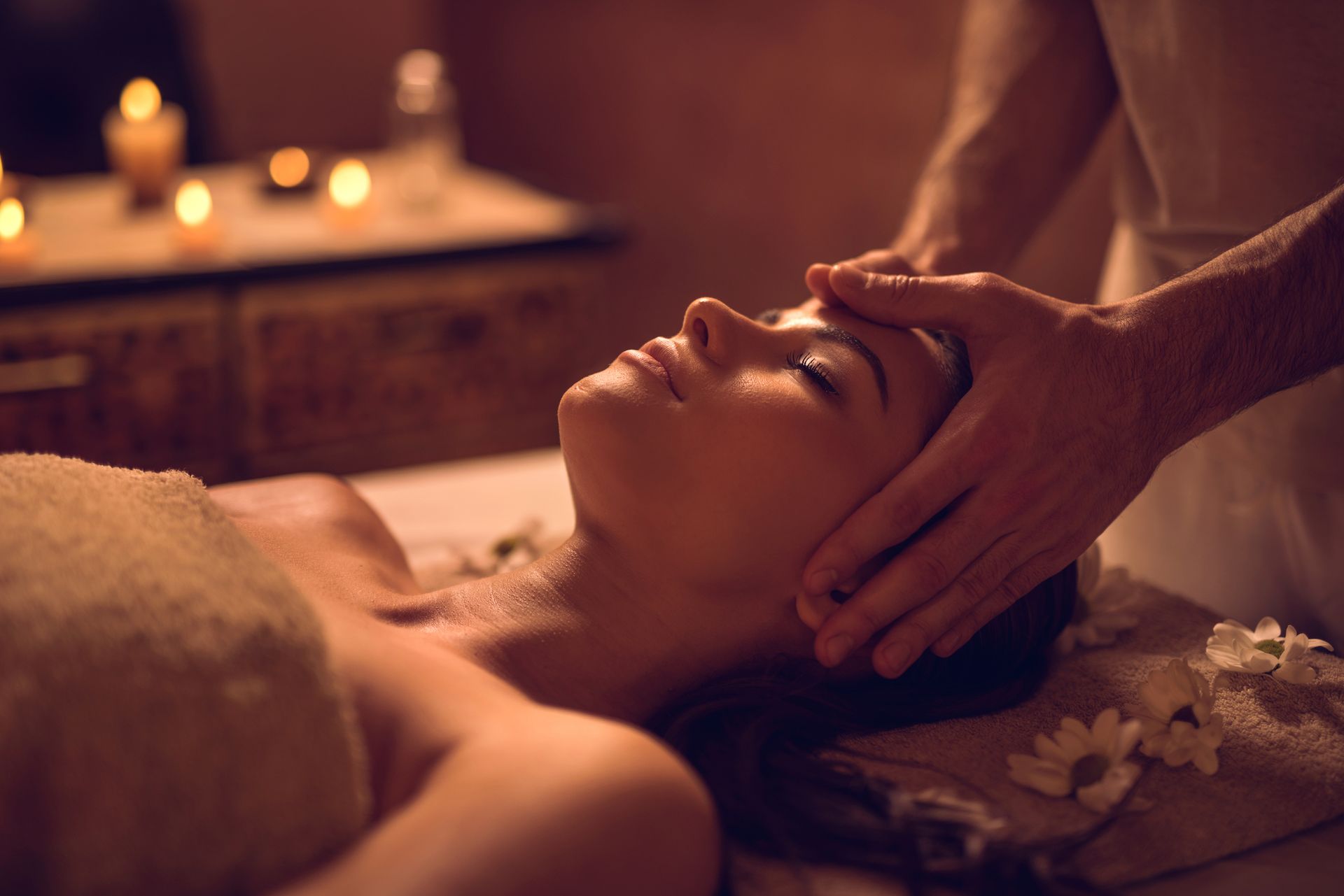 A Woman Is Getting a Head Massage at A Spa - Honolulu, HI - Hawaii Choi Spa