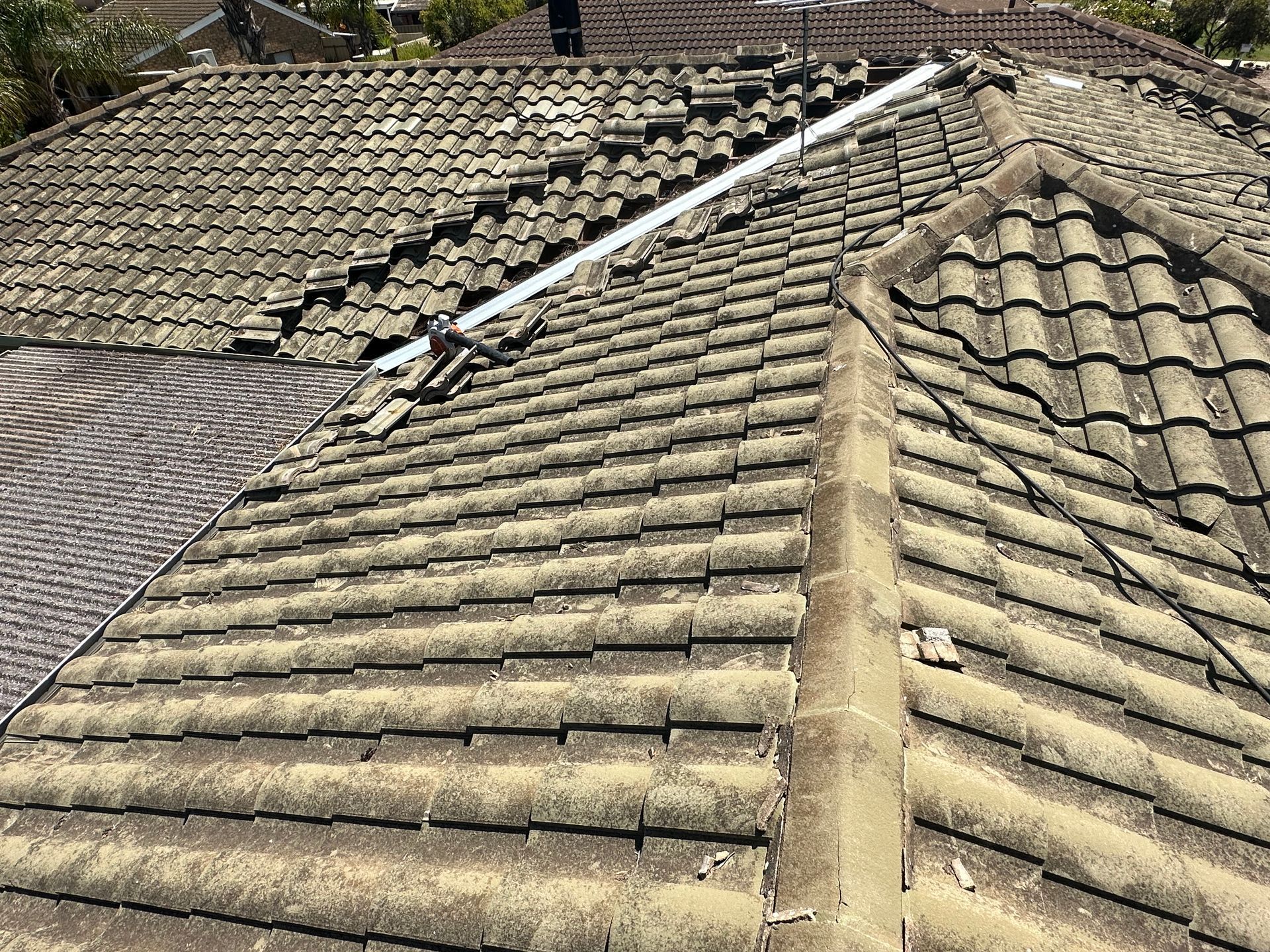 A close up of a tiled roof of a house.