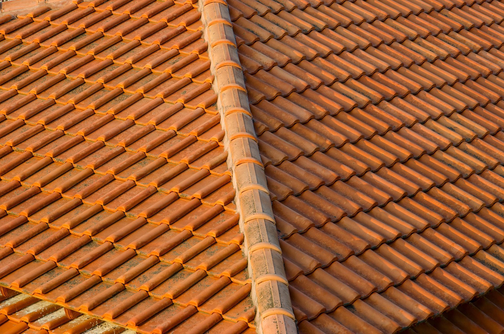 A close up of a roof with a lot of tiles on it.