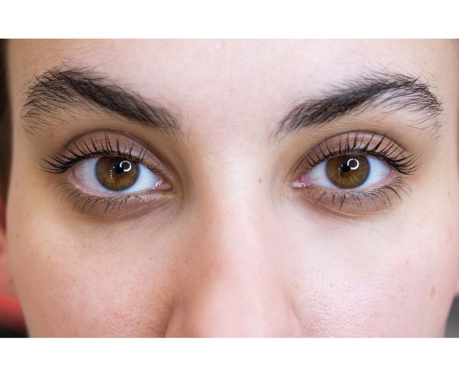 A close up of a woman 's eyes with mascara on.