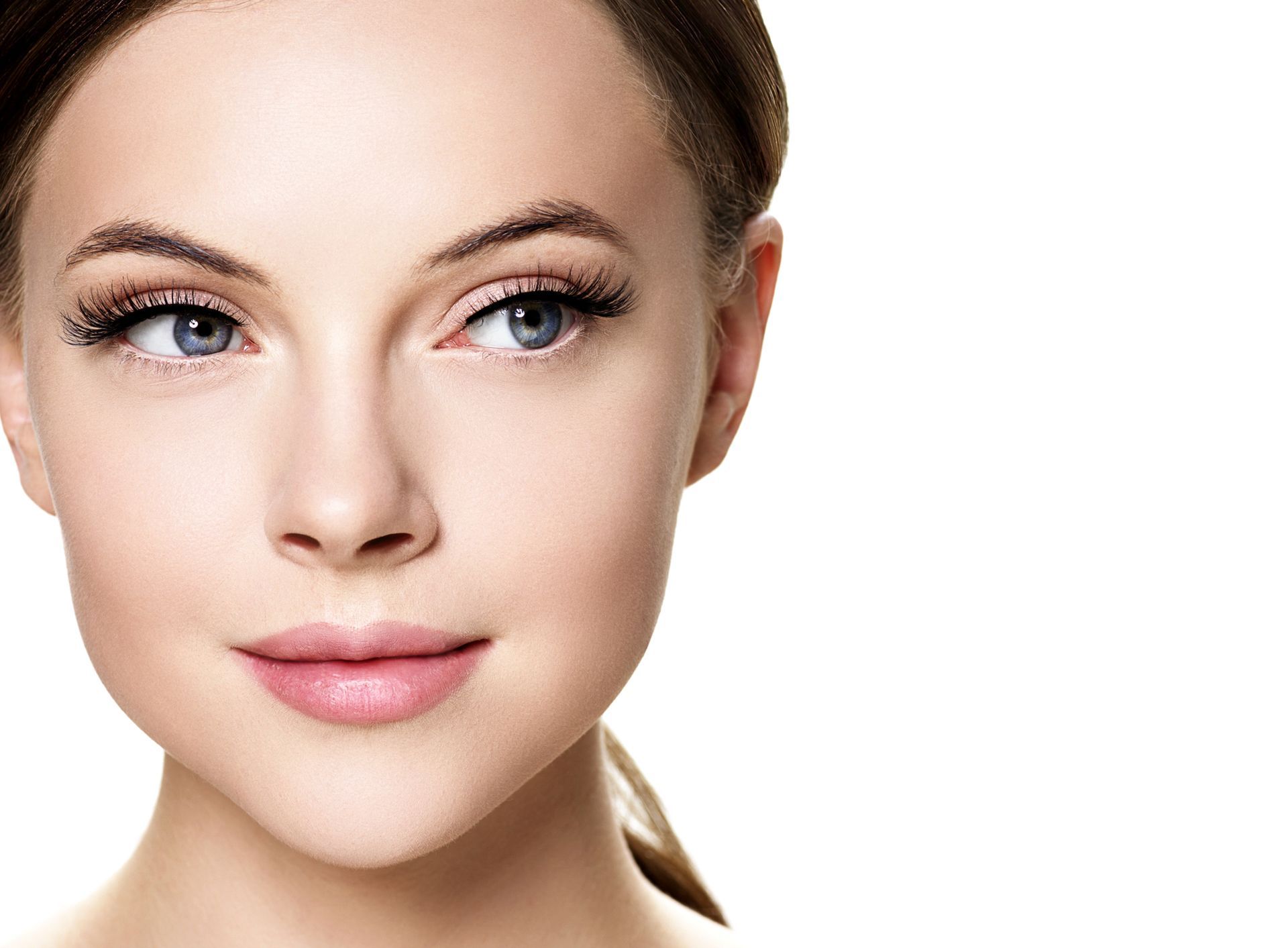 A close up of a woman 's face with a white background