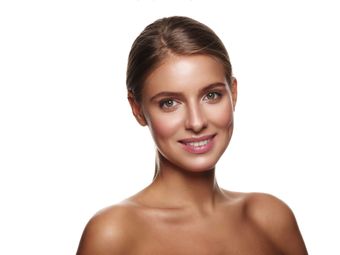 A close up of a woman 's face on a white background.