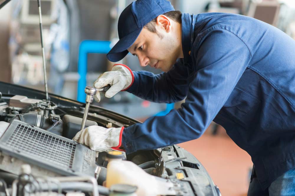 Auto Mechanic Working On A Car — Mechanic In Marulan, NSW