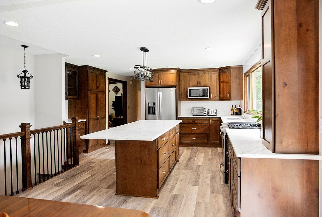 There is a large island in the middle of the kitchen.