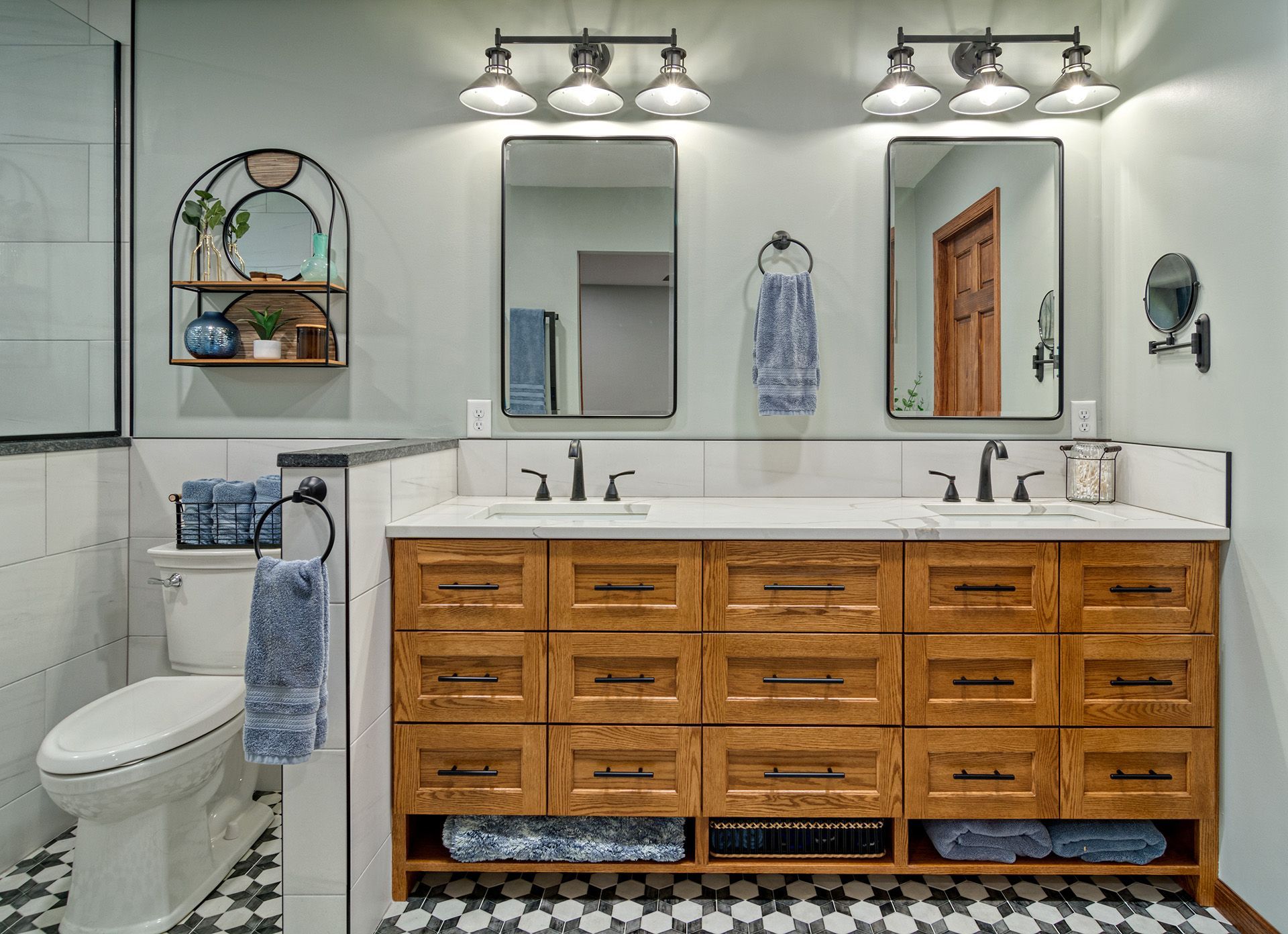 Bathroom with wooden vanity, shelf, and trim