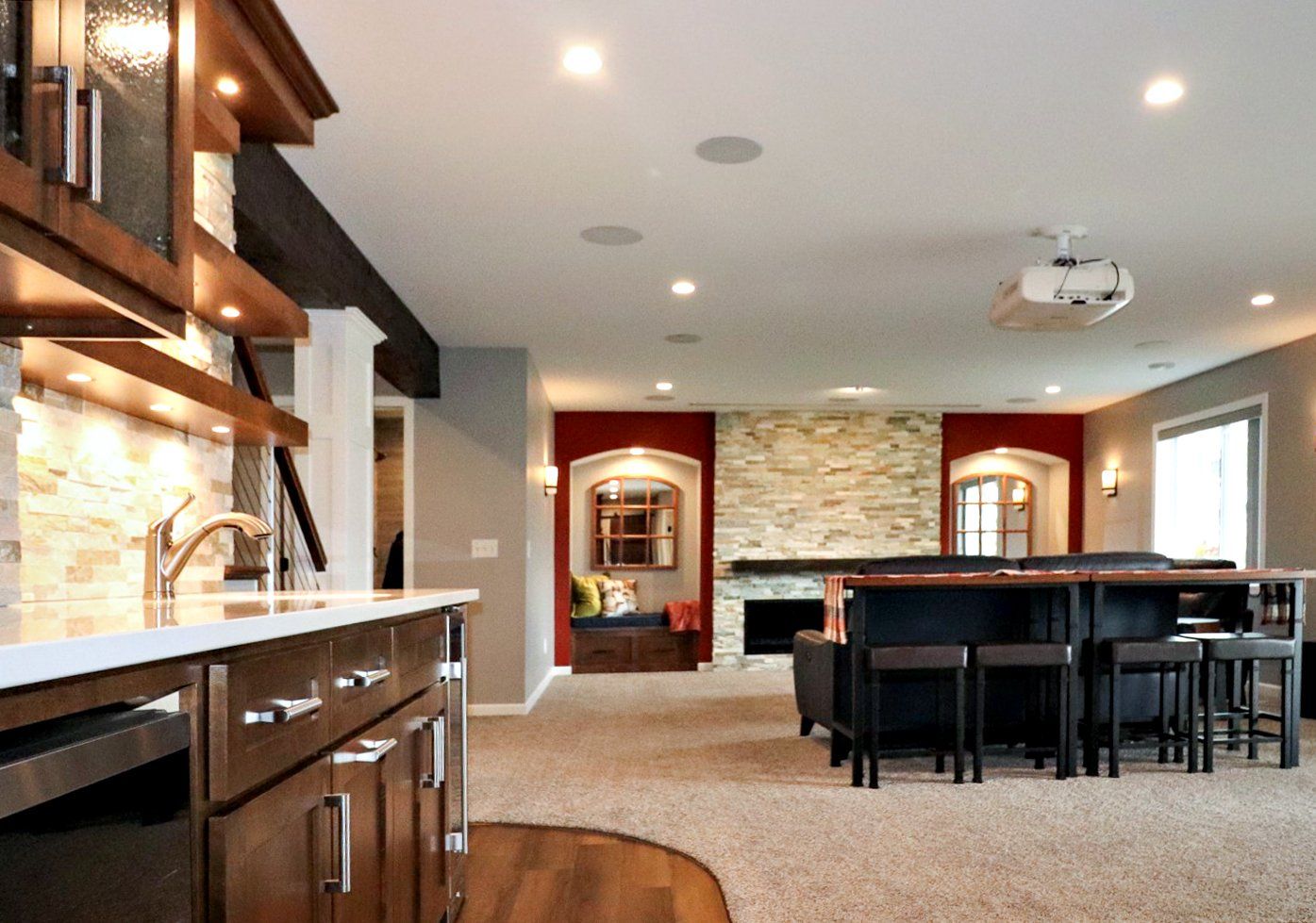 A living room with a projector on the ceiling