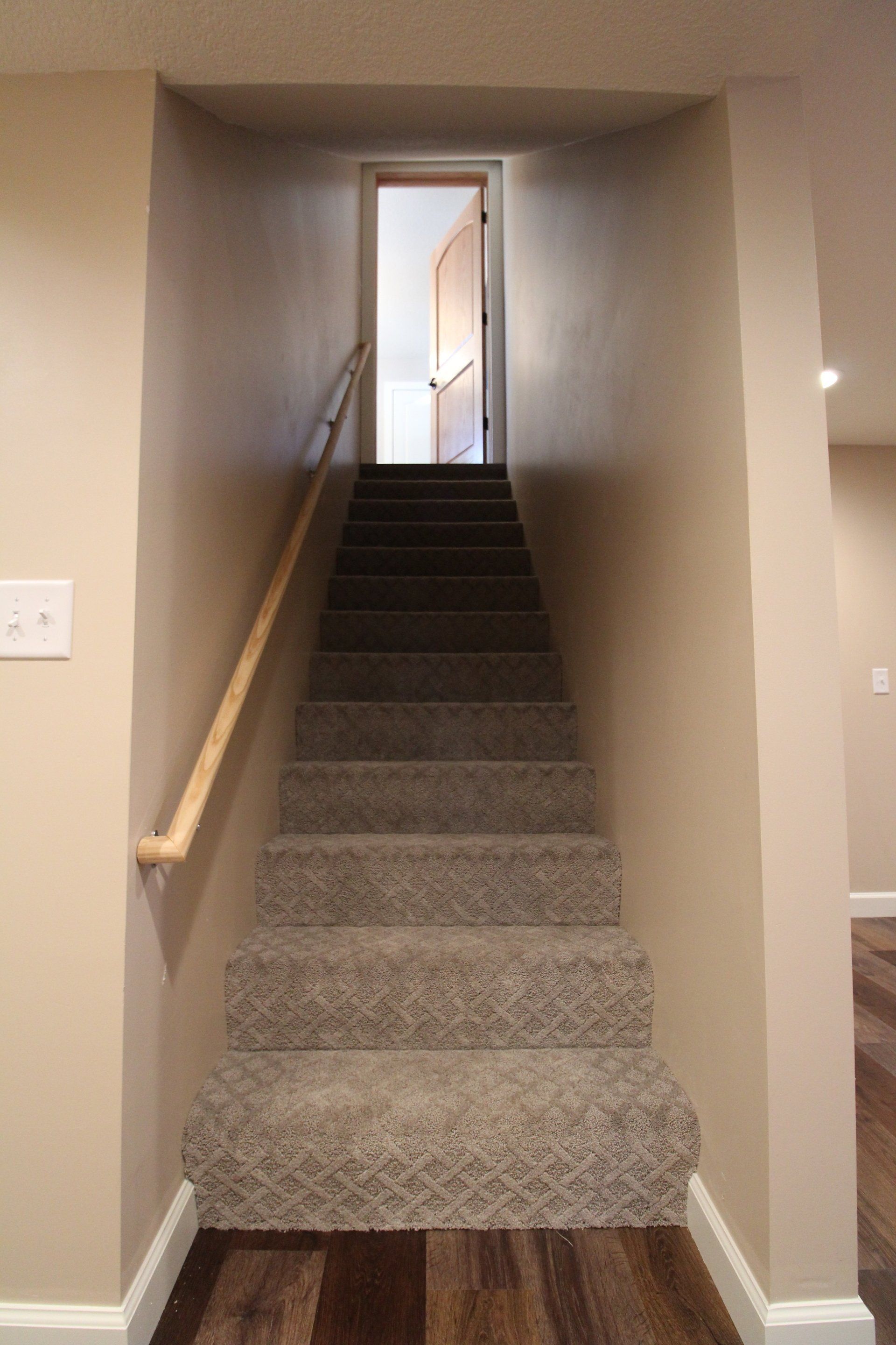 A set of stairs leading up to the second floor of a house.