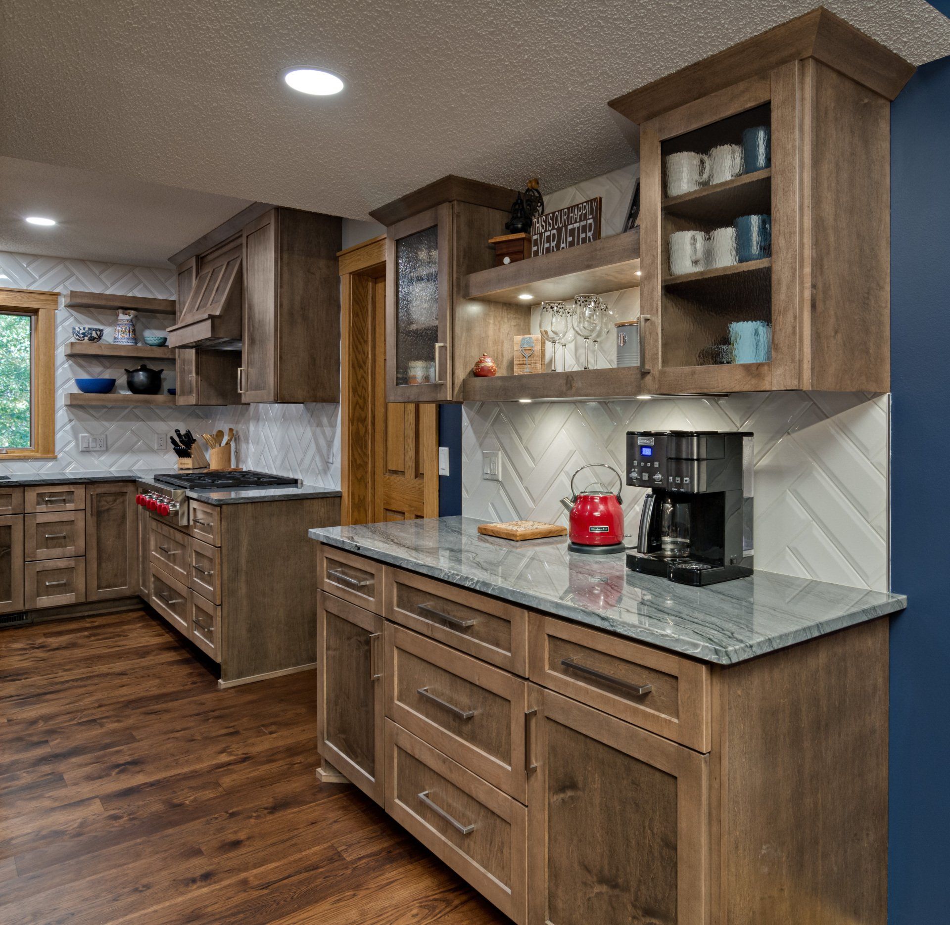 A kitchen with wooden cabinets and a coffee maker