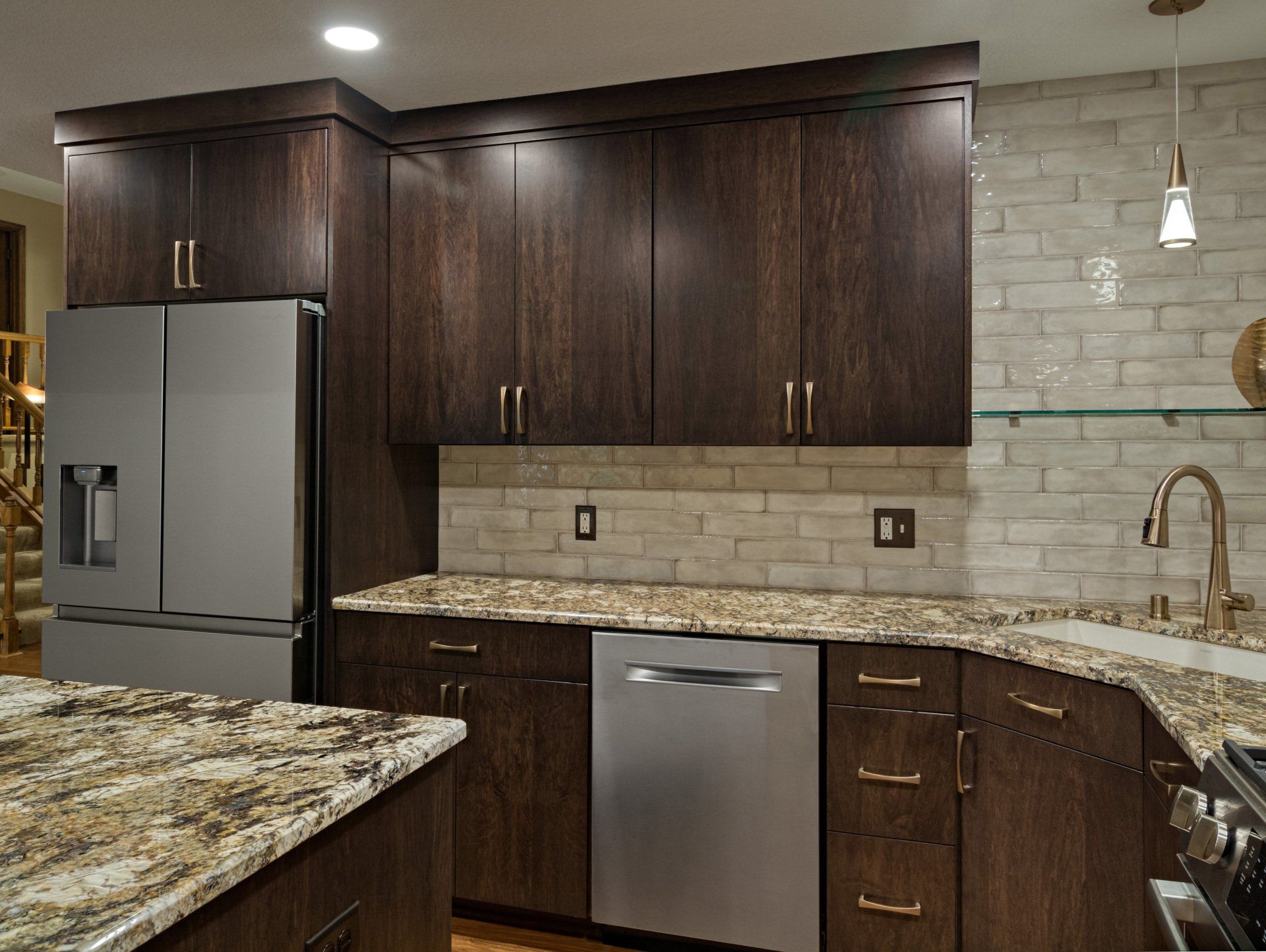 A kitchen with stainless steel appliances and granite counter tops