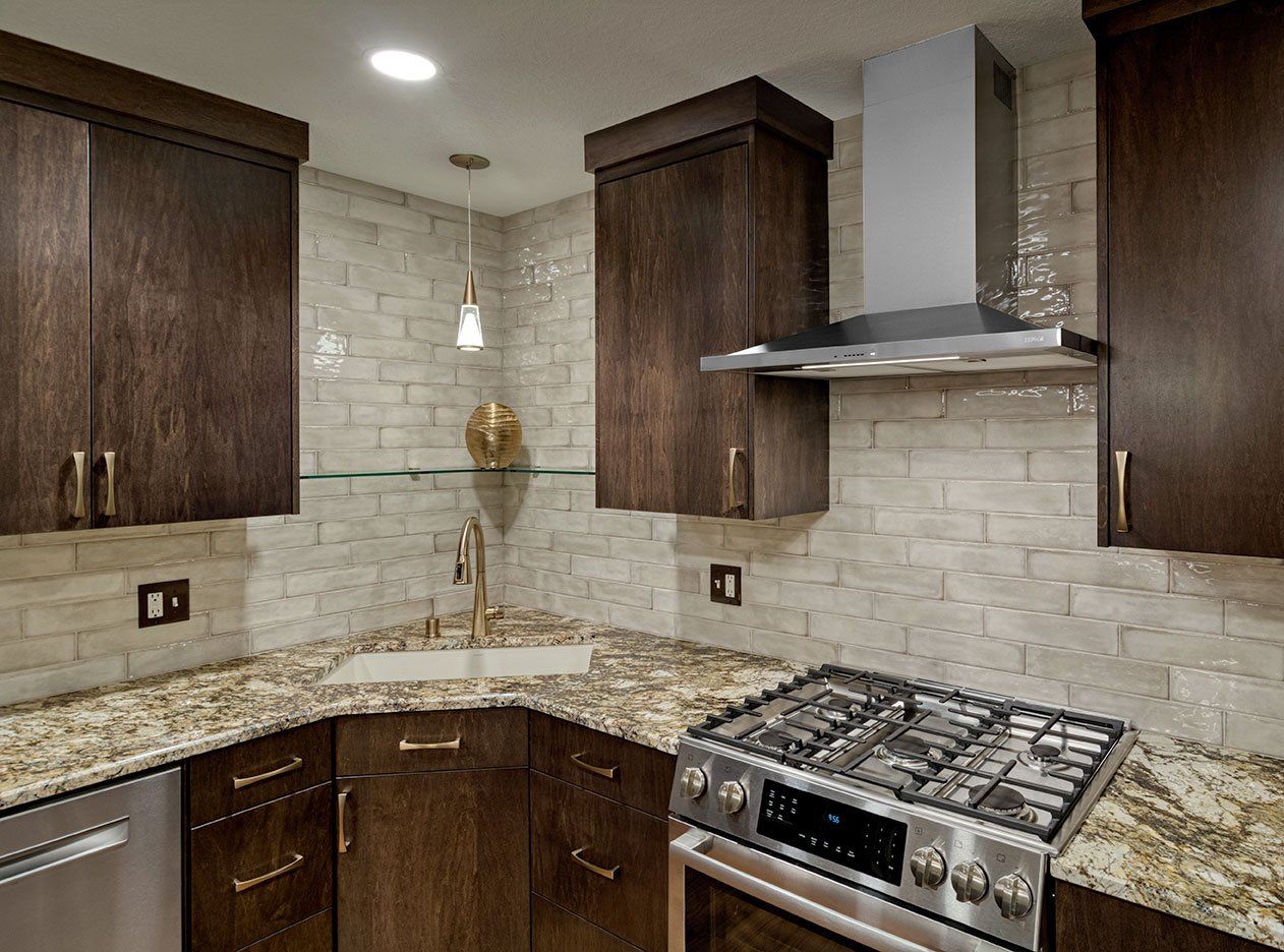 A kitchen with stainless steel appliances and granite counter tops