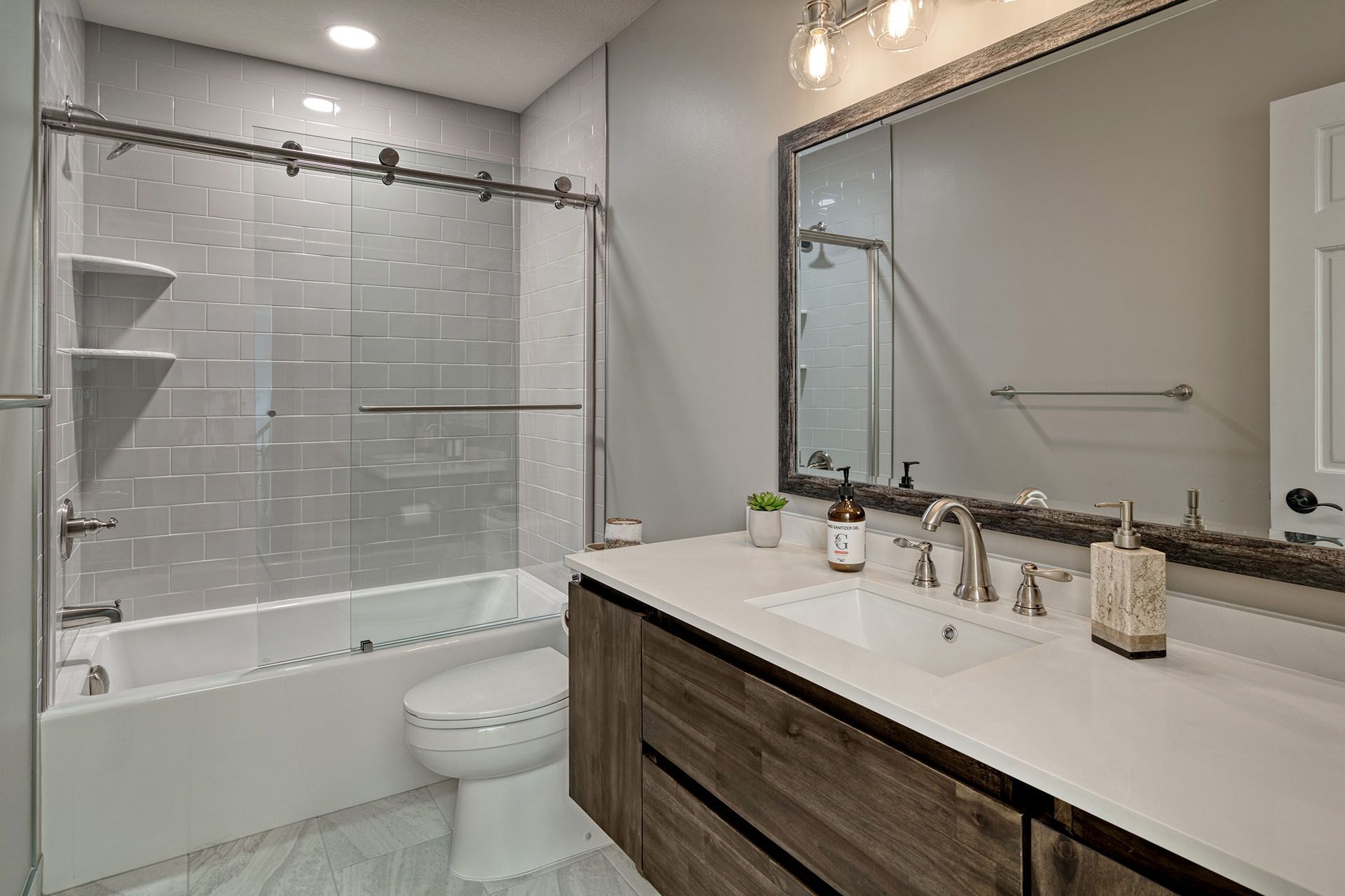 A bathroom with a toilet , sink , and shower.