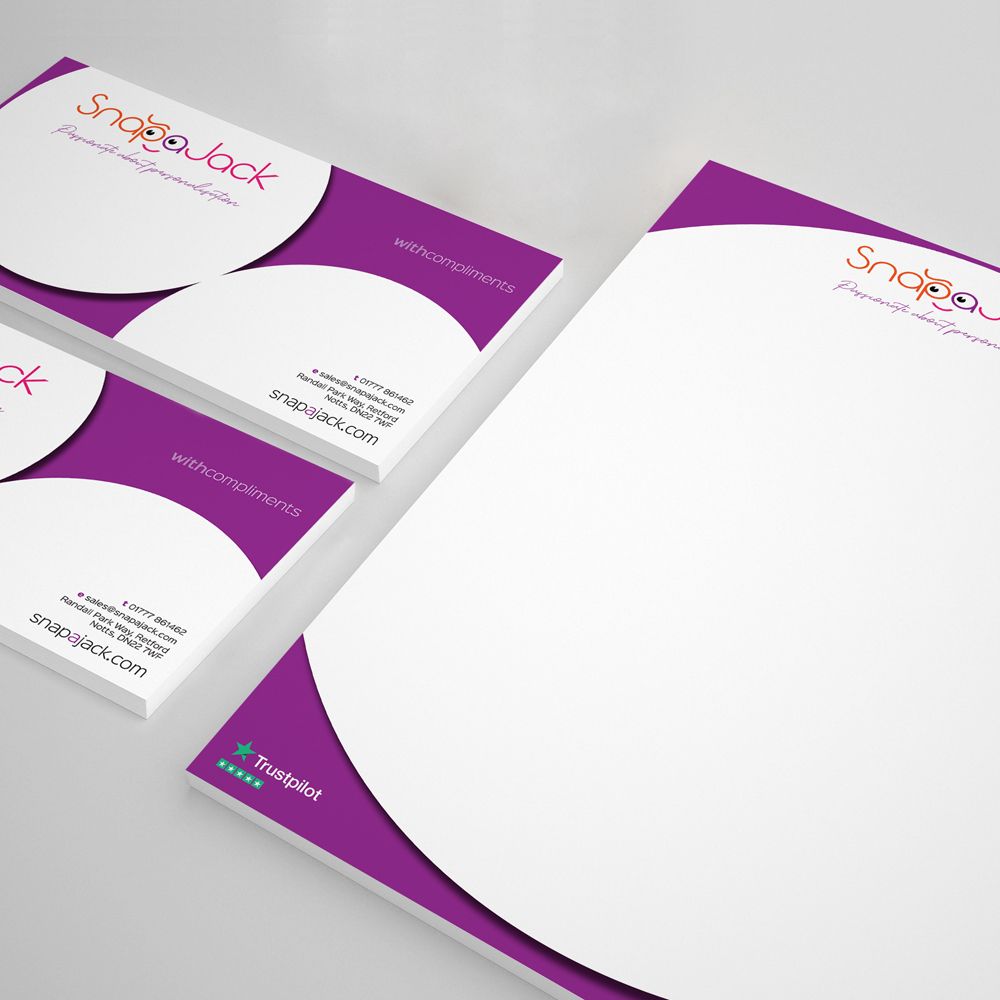 A business branding set featuring business cards and letterhead with a purple and white curved design and SnapJack logo.