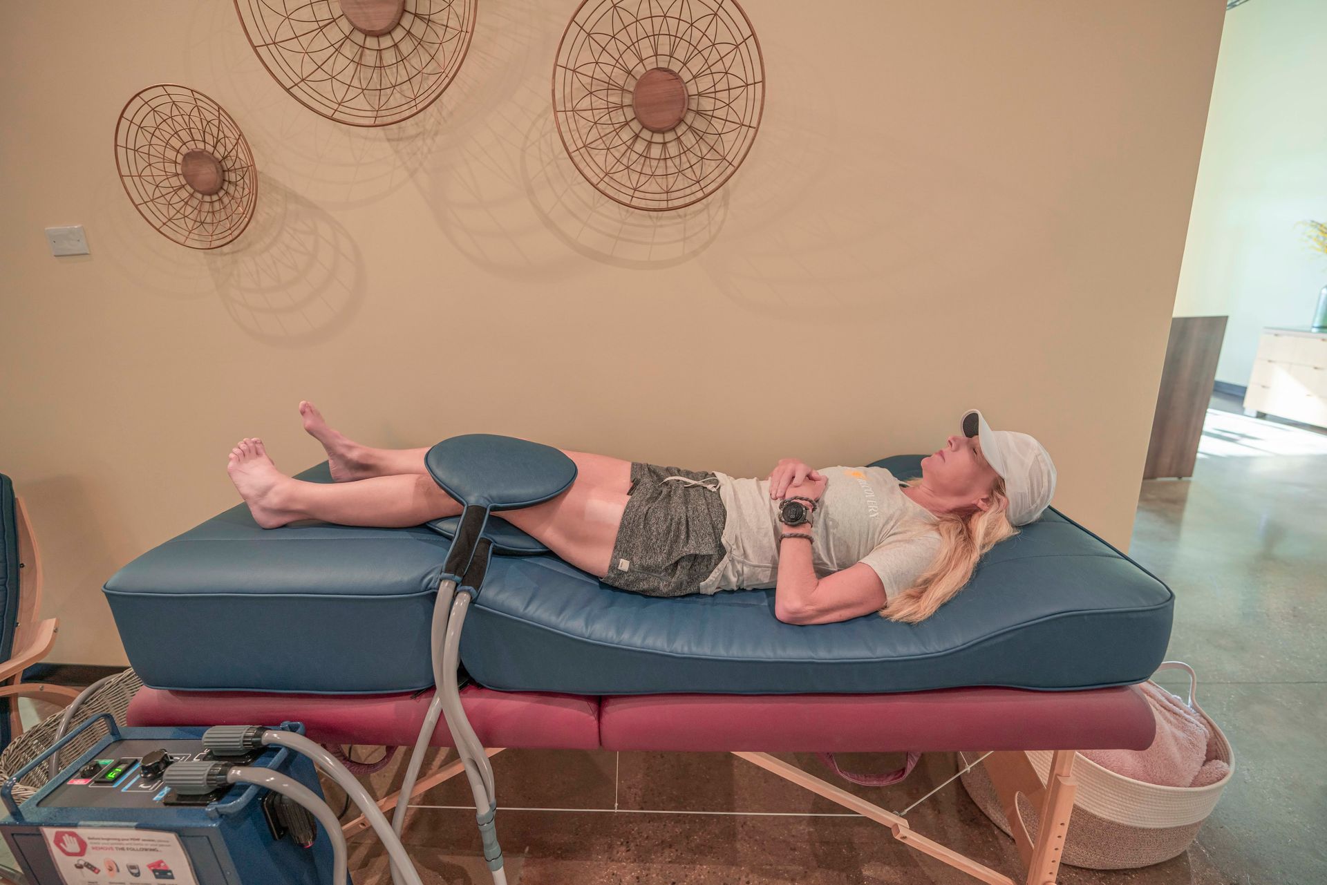 A blue chair sits next to a blue pulse machine