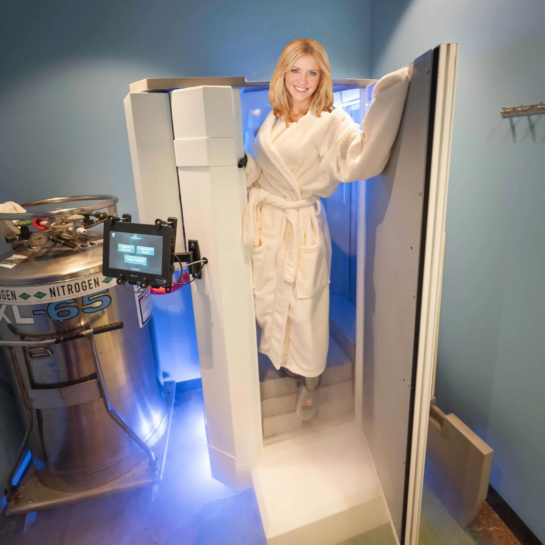 A shirtless man is standing in a blue lighted room.
