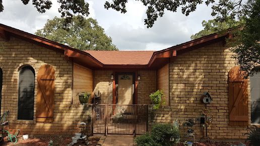 A fireplace with a picture on the wall above it