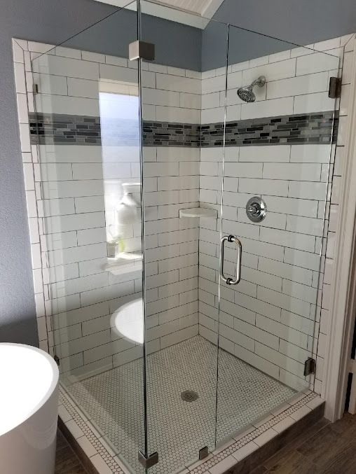 A restaurant with tables and chairs and a kitchen in the background.