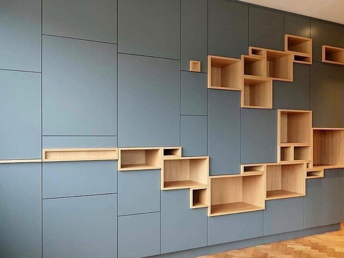 A wall with a lot of wooden shelves on it