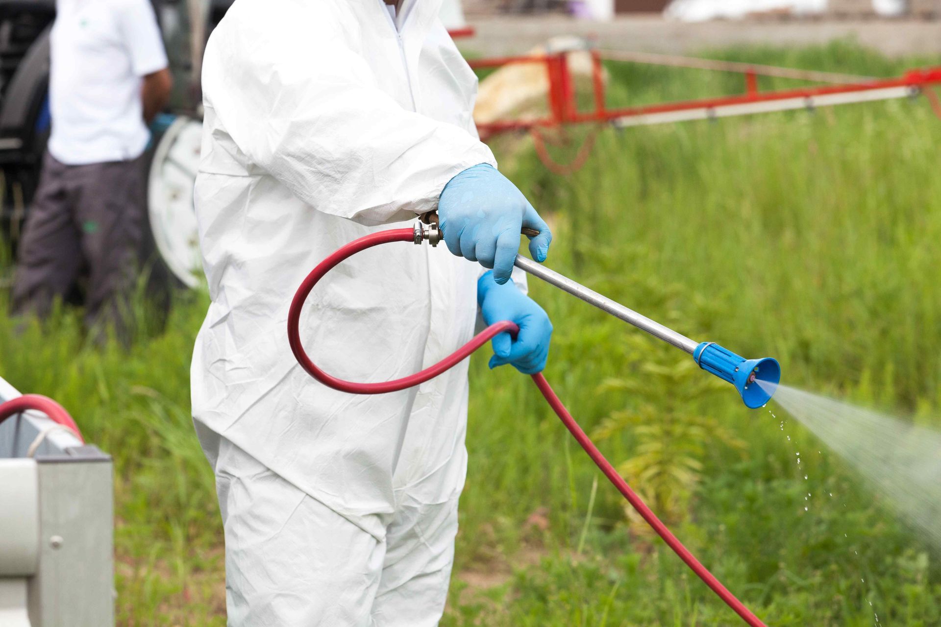 A worker spraying pest control