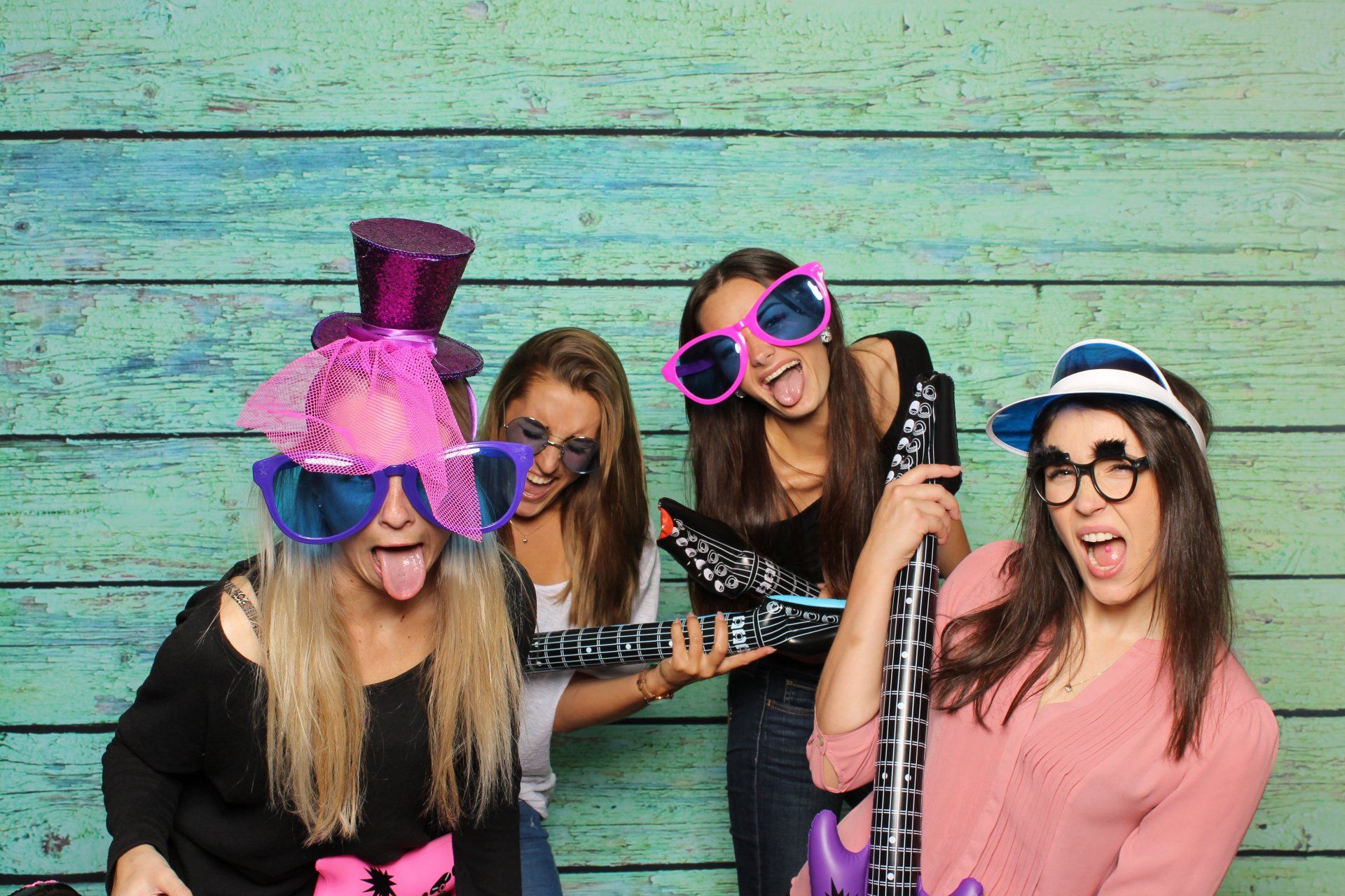 4 girls in a great time in a photo booth