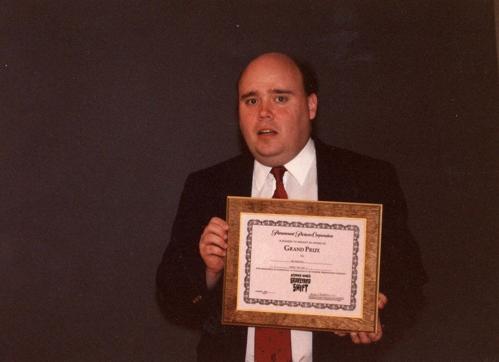 Mac the camera guy with award from paramount pictures