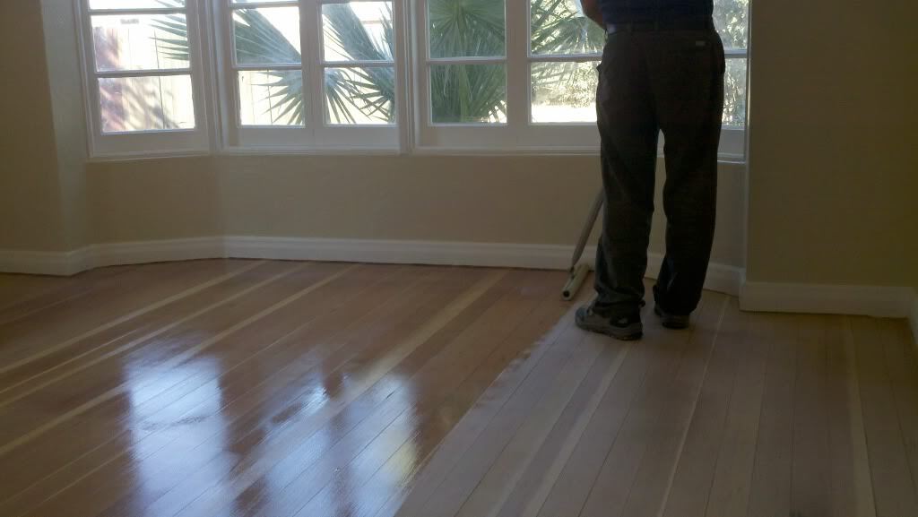 A kitchen with Talavera tile backsplash and black quartz countertops