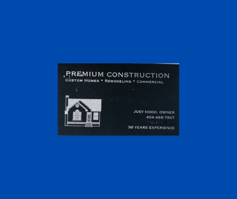 a black business card for premium construction on a blue background