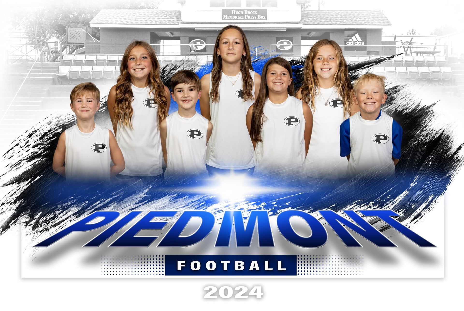 a group of children are standing next to each other in front of a football field .