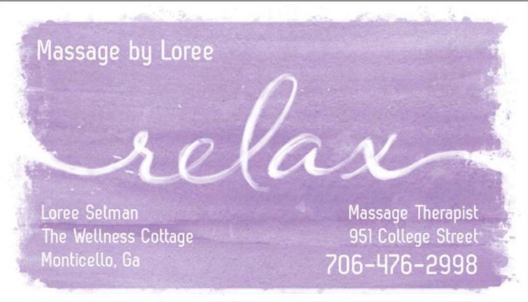 a purple sign that says massage by loree