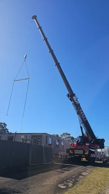 Biglift Cranes mobile crane lifting materials at a residential site in Sydney