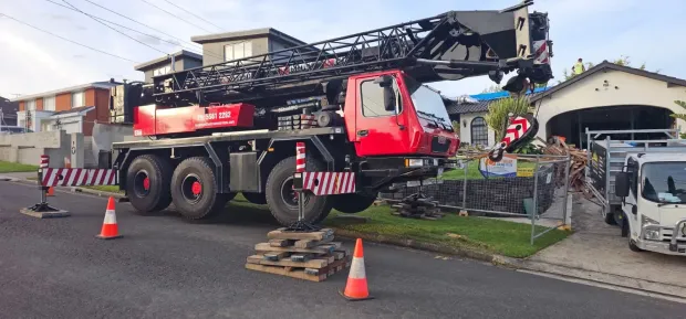 Mobile crane set up for residential crane hire services at a Sydney property