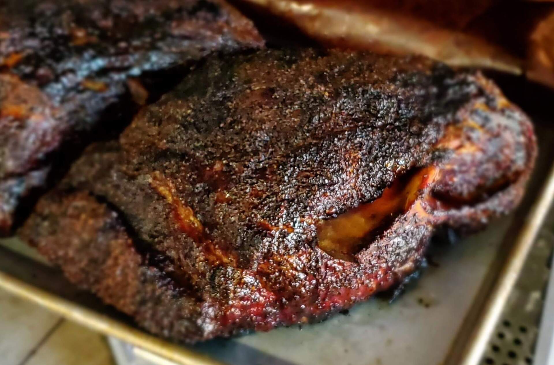 A close up of a piece of meat on a pan